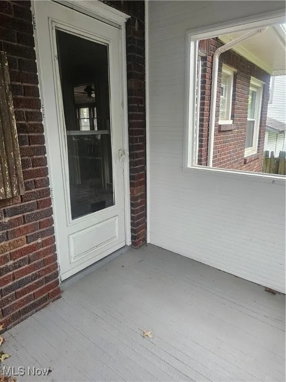 Property entrance with brick siding