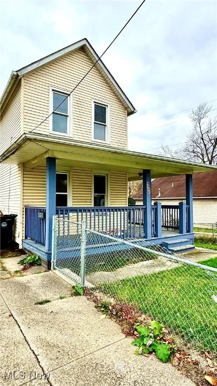 Traditional-style home with covered porch