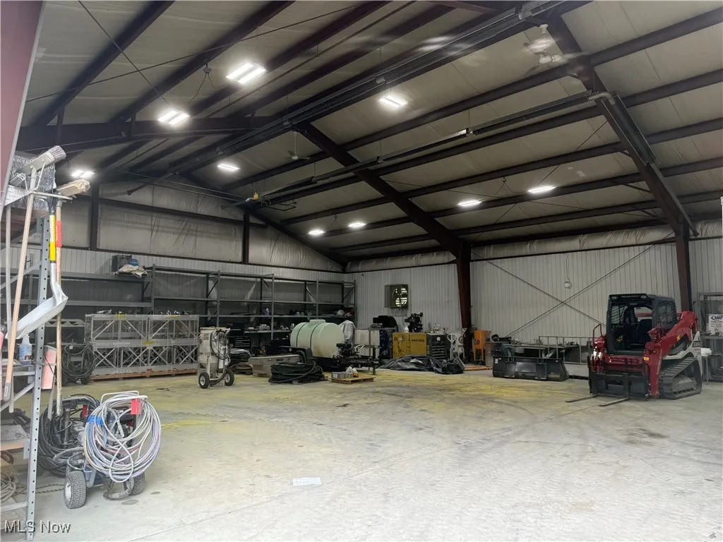 Garage featuring metal wall