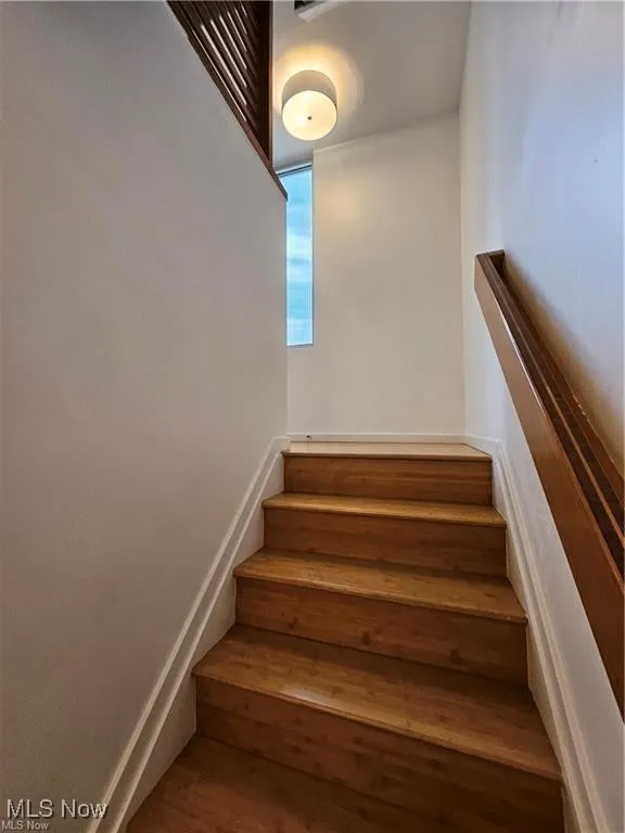 Staircase with wood finished floors