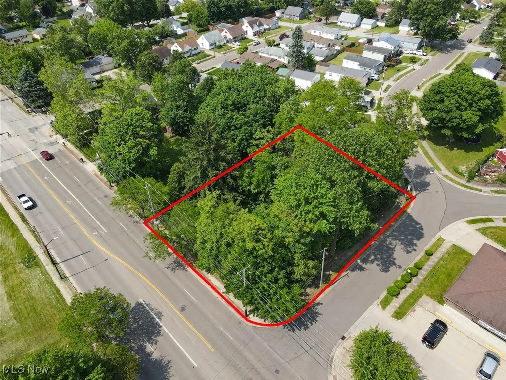 Aerial view of residential area with property boundaries highlighted