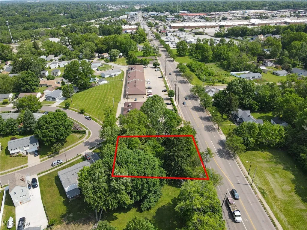 Aerial overview of property's location featuring property parcel outlined