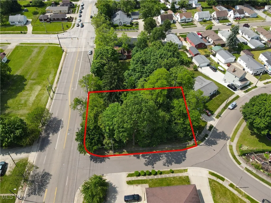 Aerial view of residential area with property boundaries highlighted