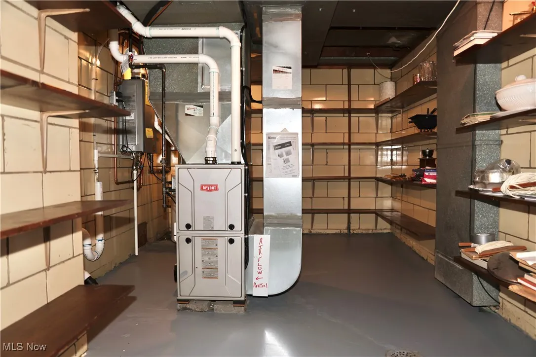 Utility room featuring heating unit