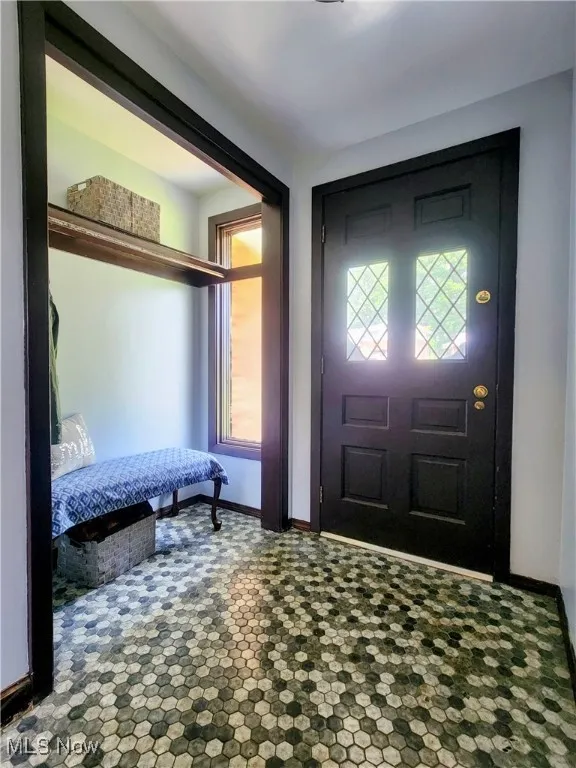 Entrance foyer featuring baseboards