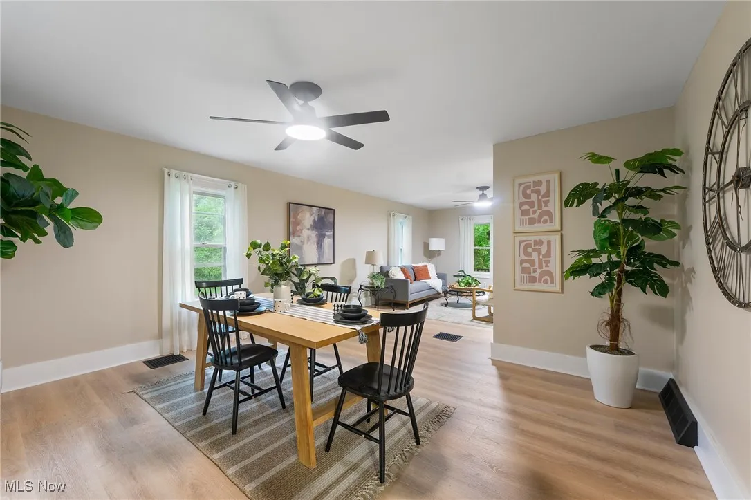 Dining room featuring ceiling fan and light wood finished floors