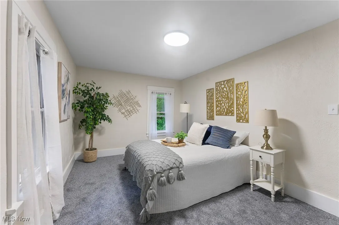 Carpeted bedroom with baseboards