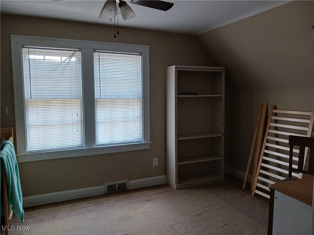  bedroom featuring carpet flooring and ceiling fan