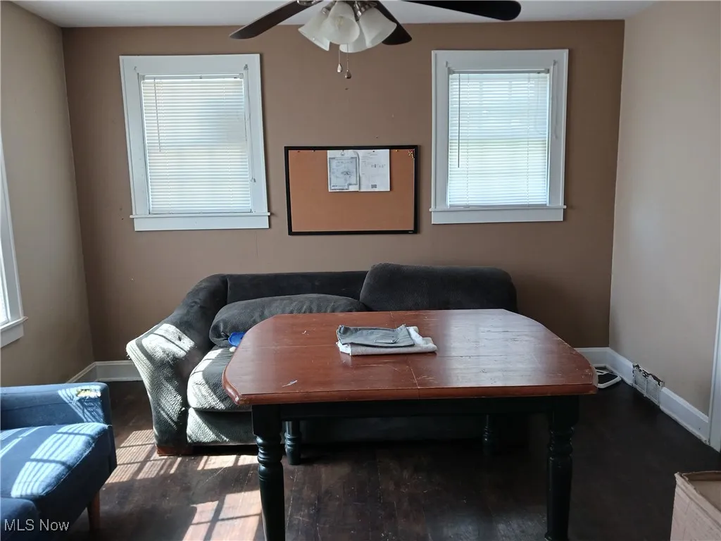 Dining room featuring a ceiling fan and wood finished floors
