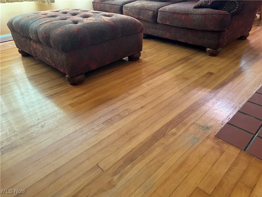 Living room with hardwood / wood-style flooring