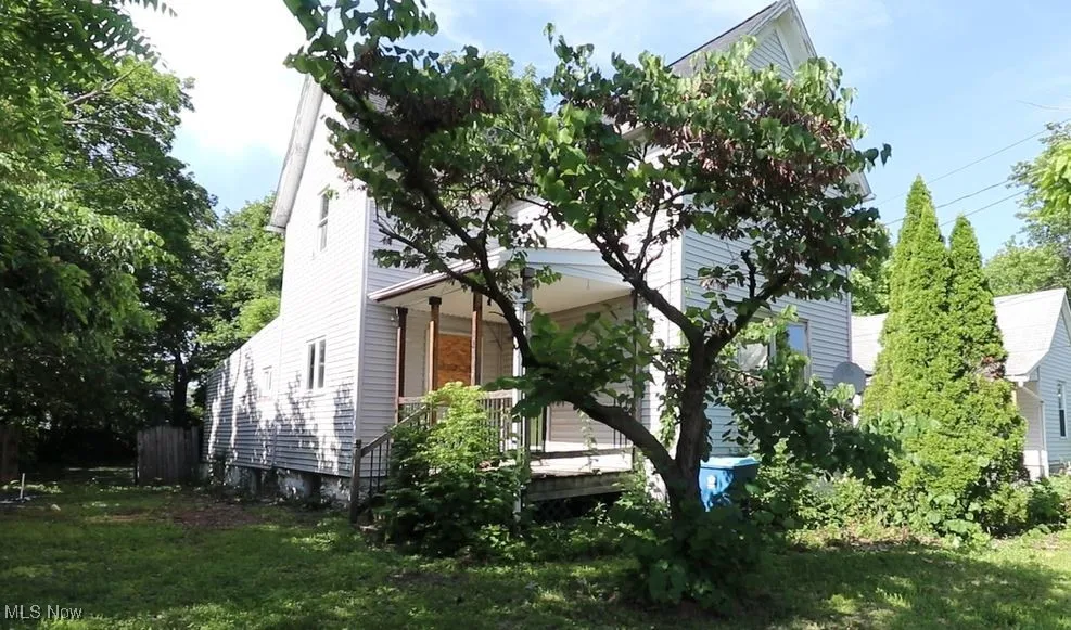 View of home's exterior featuring covered porch
