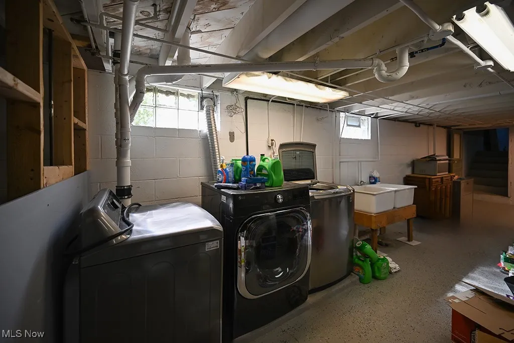 Washroom featuring washer and clothes dryer
