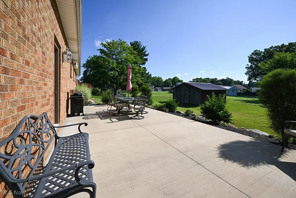 View of patio featuring outdoor dining space and area for grilling