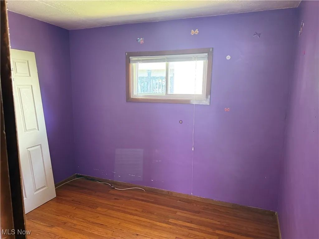 Empty room with wood finished floors