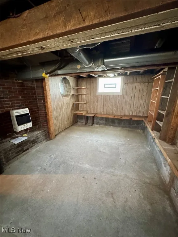 Below grade area with heating unit