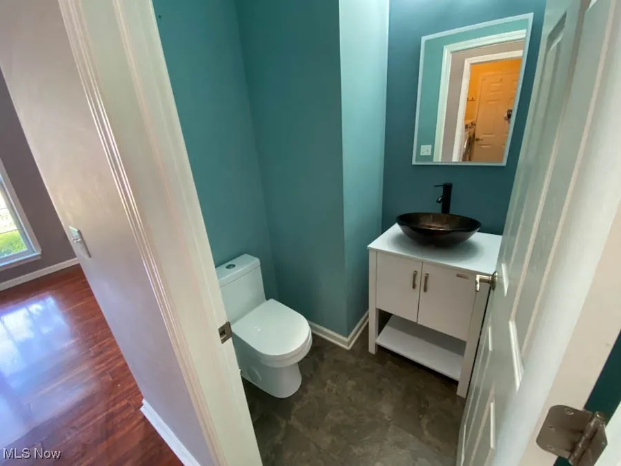 Bathroom with vanity and wood finished floors