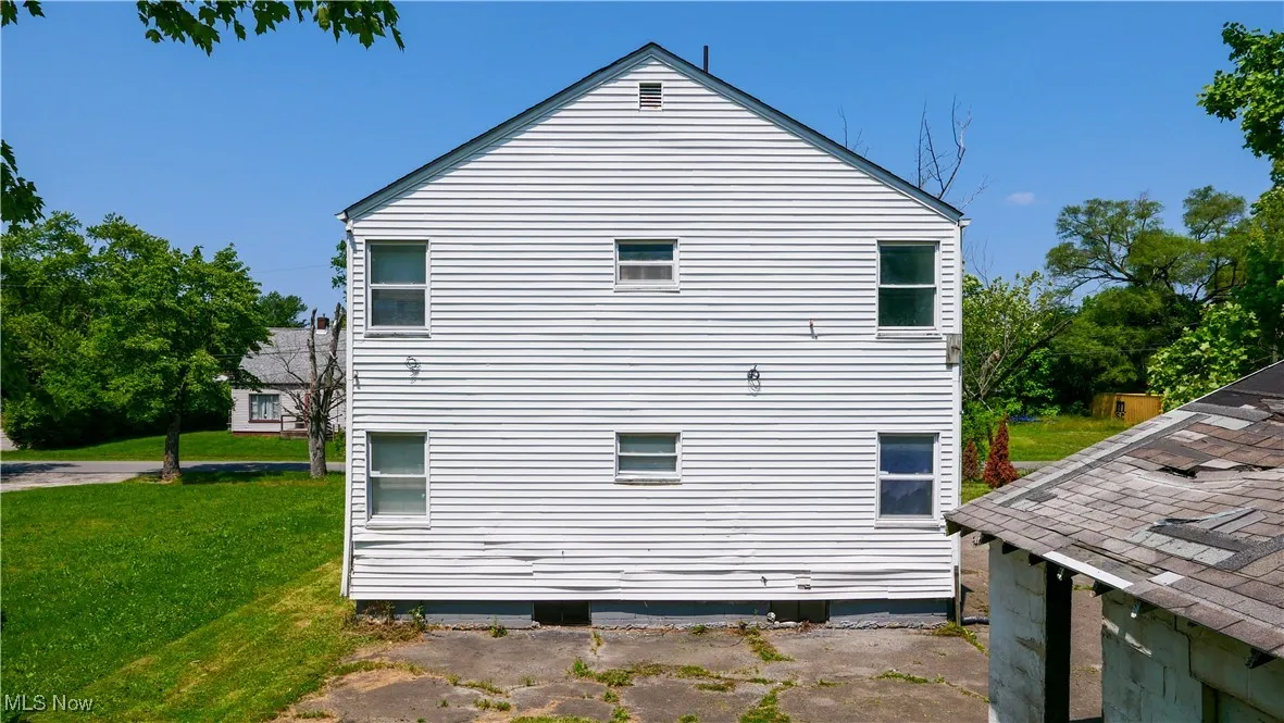 View of home's exterior with a lawn