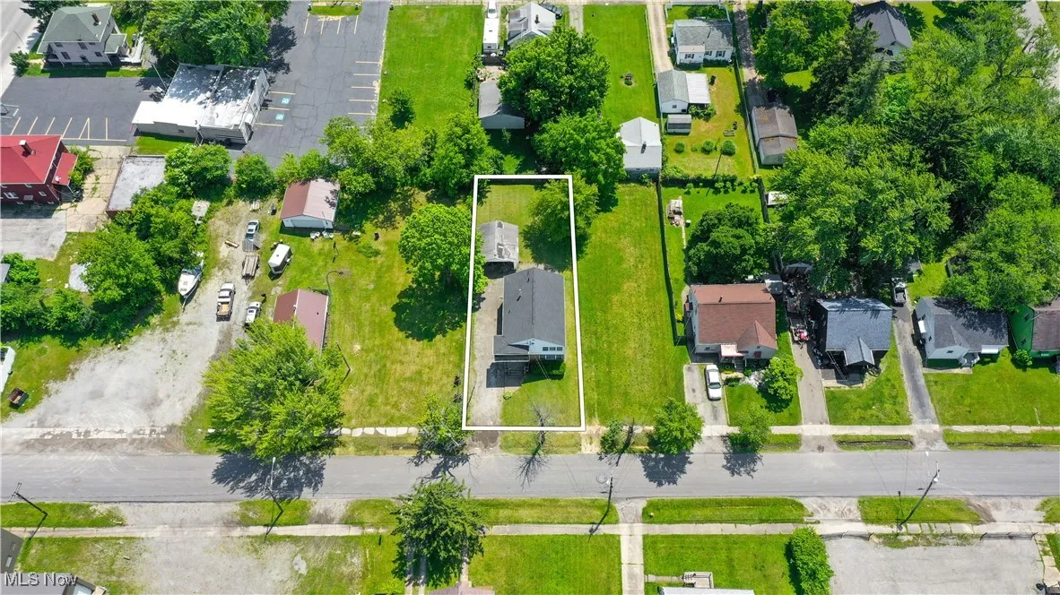 Aerial perspective of suburban area with property parcel outlined