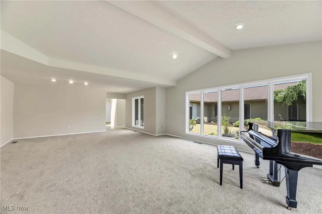 Living room with recessed lighting and large picture windows