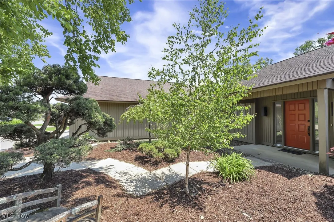 view of the front of the house with lush landscaping