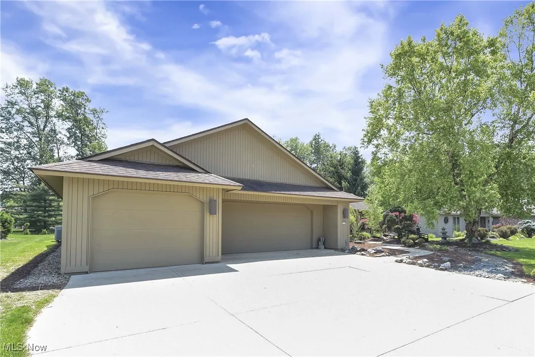 View of front of house with concrete driveway
