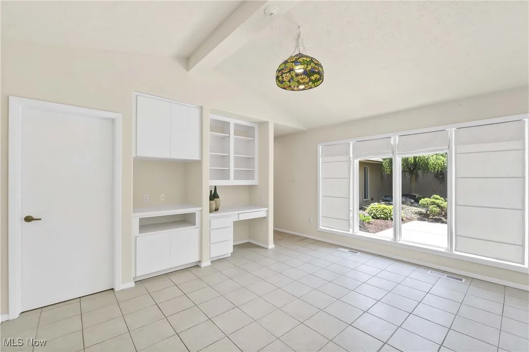 Kitchen with large windows and sliding doors. Desk area