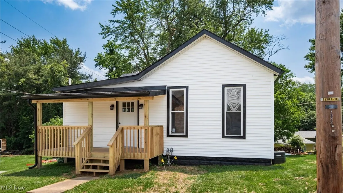 Bungalow-style home with a front yard