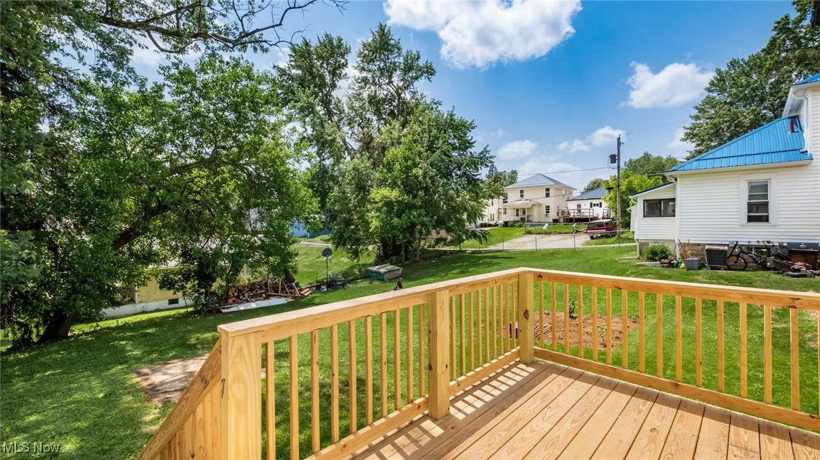 Deck with a lawn and a residential view