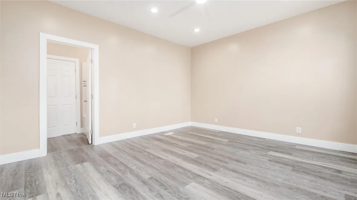 Unfurnished room with a ceiling fan, light wood finished floors, and recessed lighting