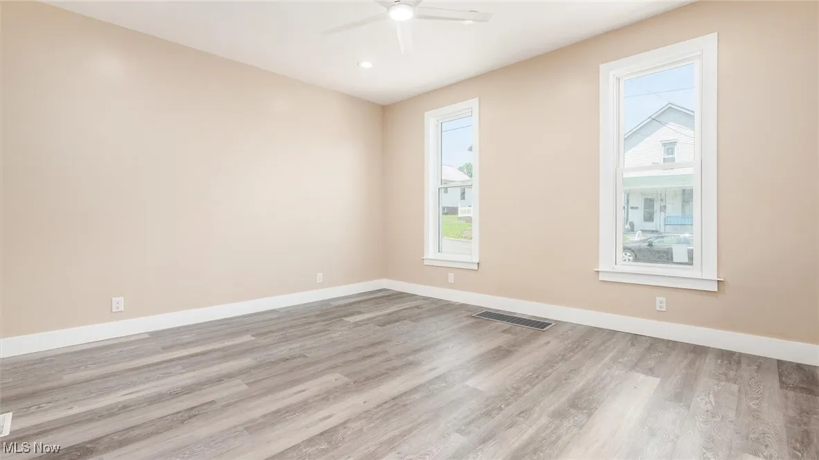 Spare room featuring ceiling fan, wood finished floors, and recessed lighting