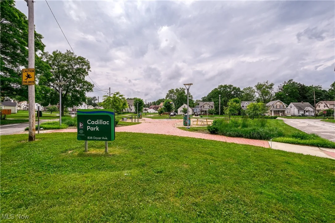 Surrounding community with a yard and a residential view
