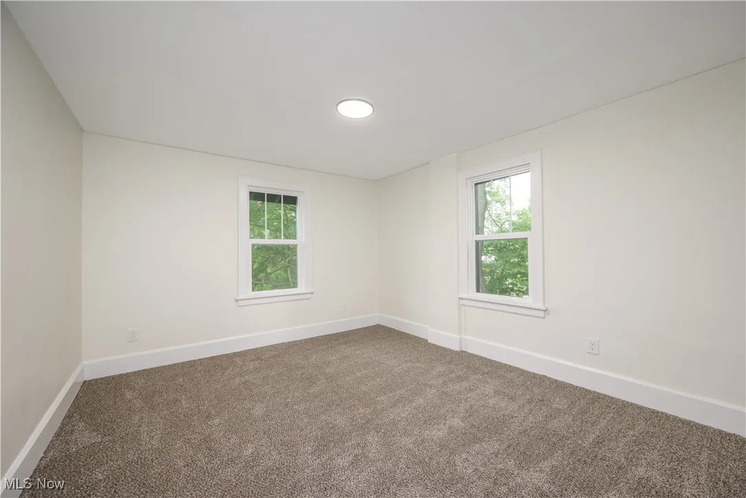 Spare room with carpet flooring and healthy amount of natural light