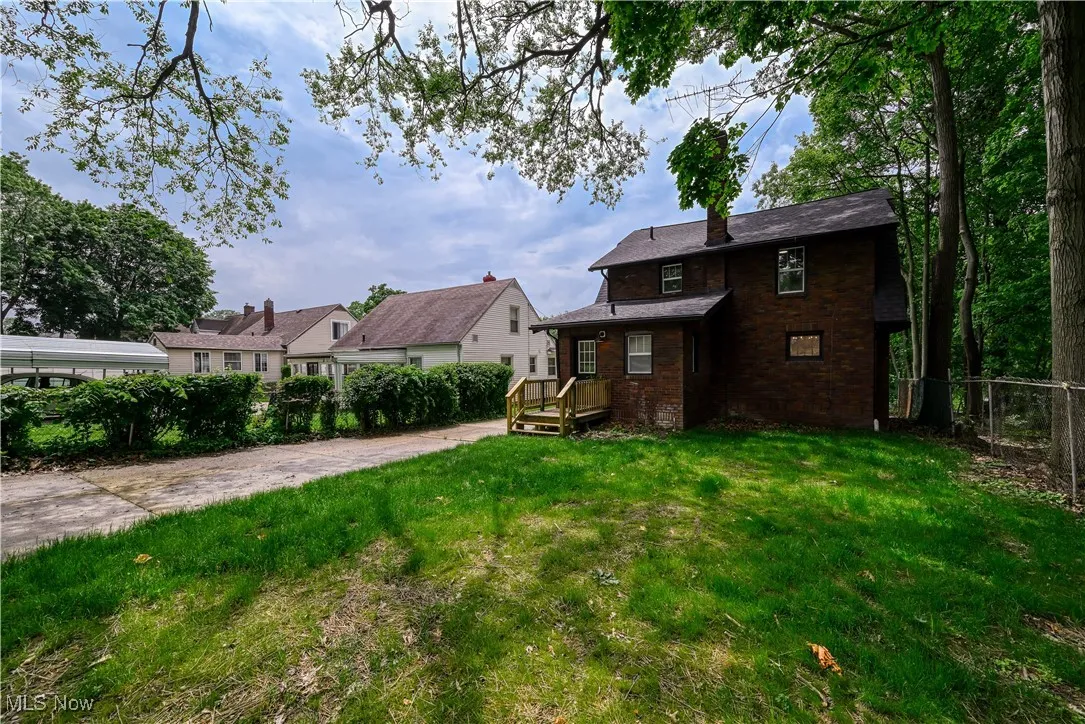 Rear view of house with brick siding