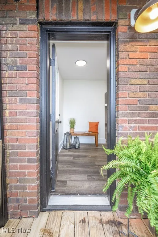 Property entrance with brick siding