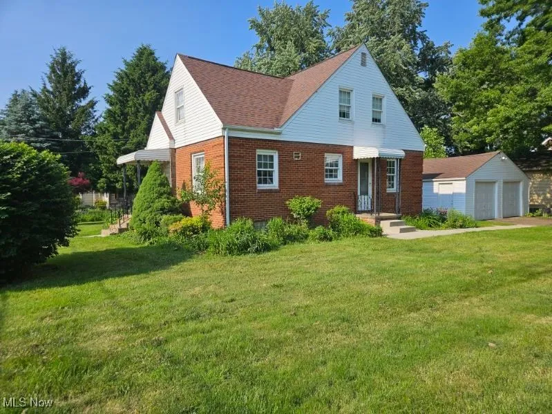 View of side of house with drive access off of side street