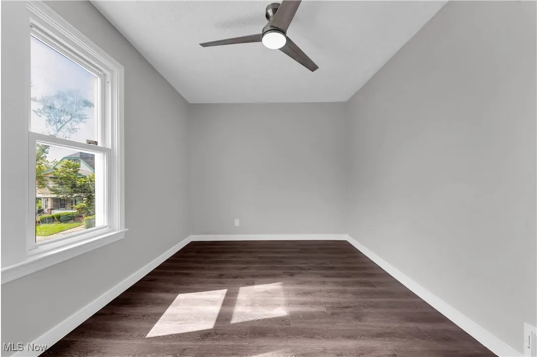 Spare room with ceiling fan and wood finished floors