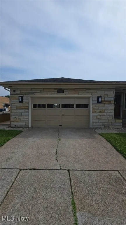 Garage with concrete driveway