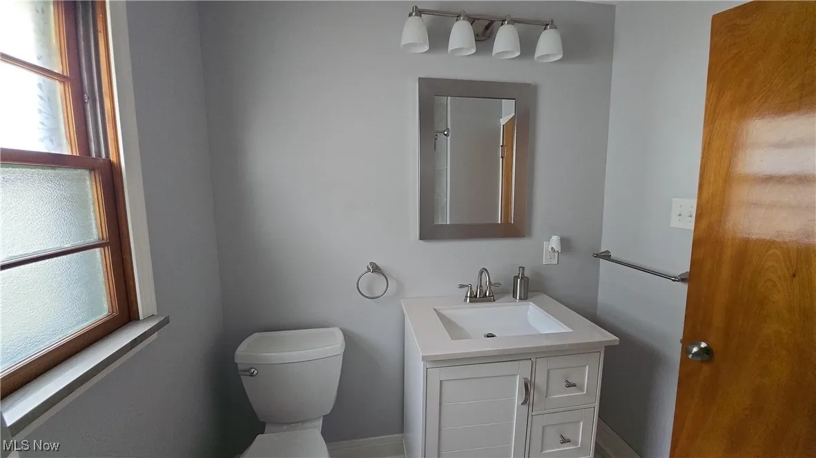 Bathroom with toilet and vanity