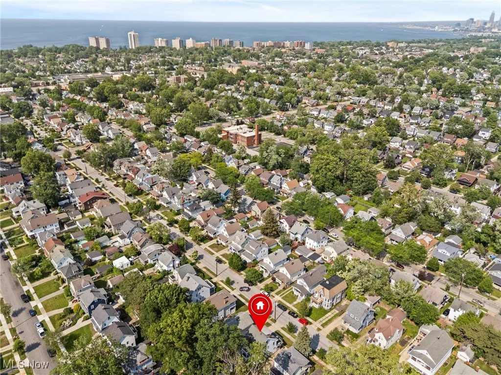 Aerial overview of property's location with a nearby body of water