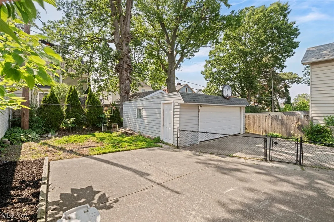 Detached garage with a gate