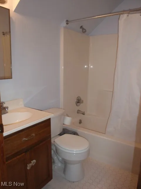 Bathroom with vanity and shower / bath combo