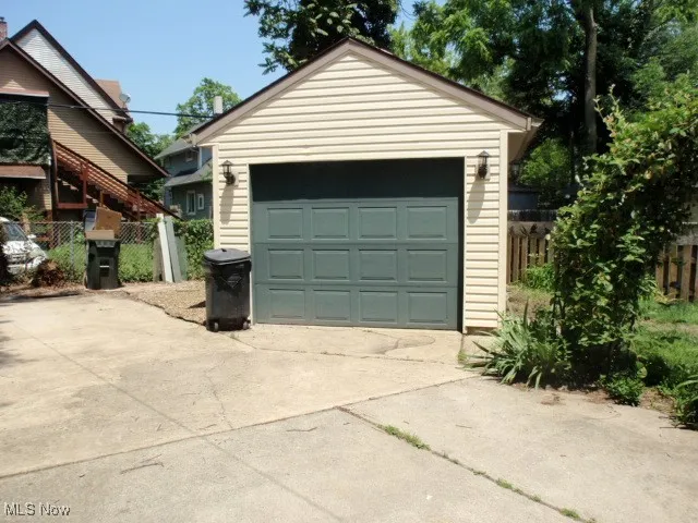 Detached garage with concrete driveway