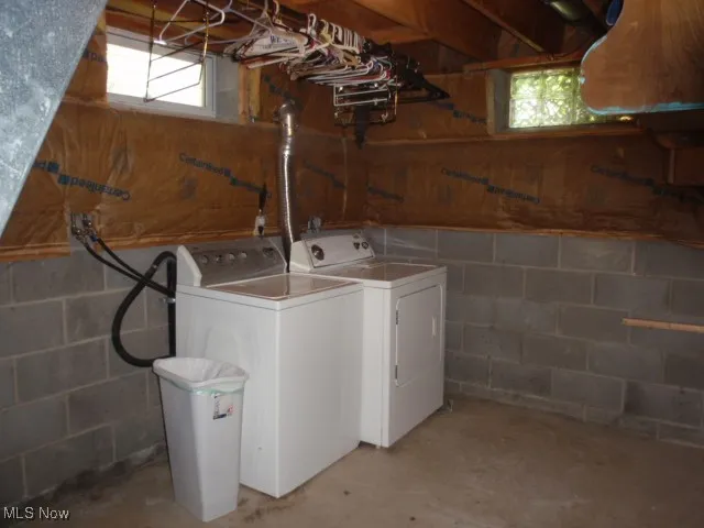 Laundry area with washer and dryer and plenty of natural light
