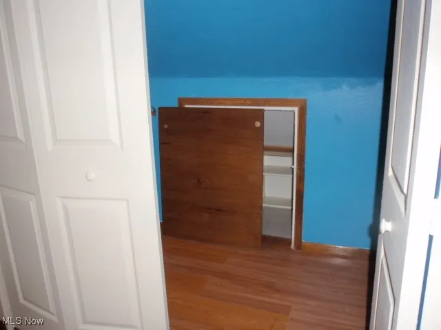 Additional storage area behind bedroom closet