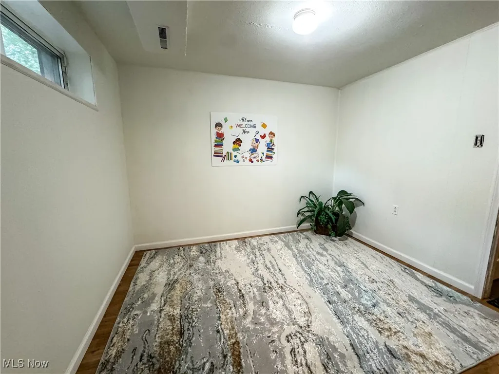 This room is located near the kitchen and perfect for a hobby room or studio.  There's a closet for neatly storing suppplies, as well.