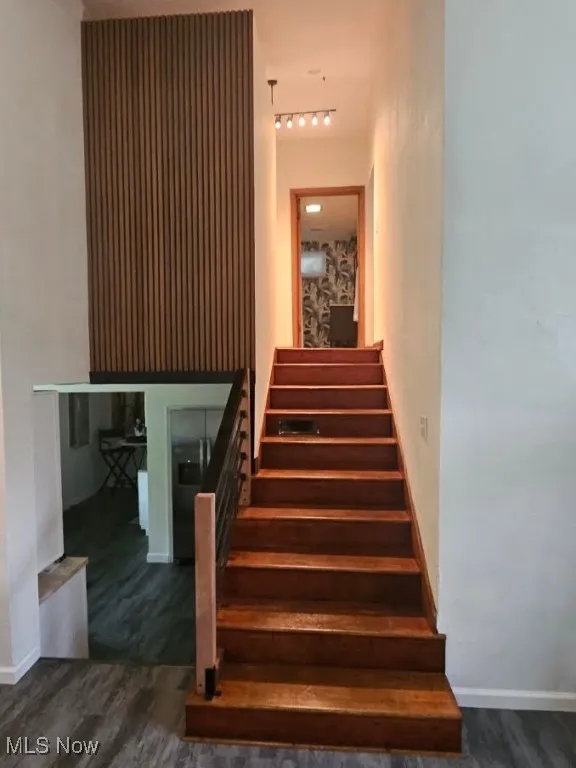 A beautiful wood acoustical wall ensures those in the bedrooms aren't disturbed by activities on the main level.
