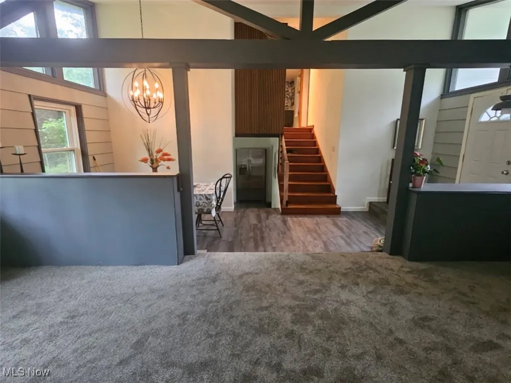 Wide view of dining room and entry from the living room.