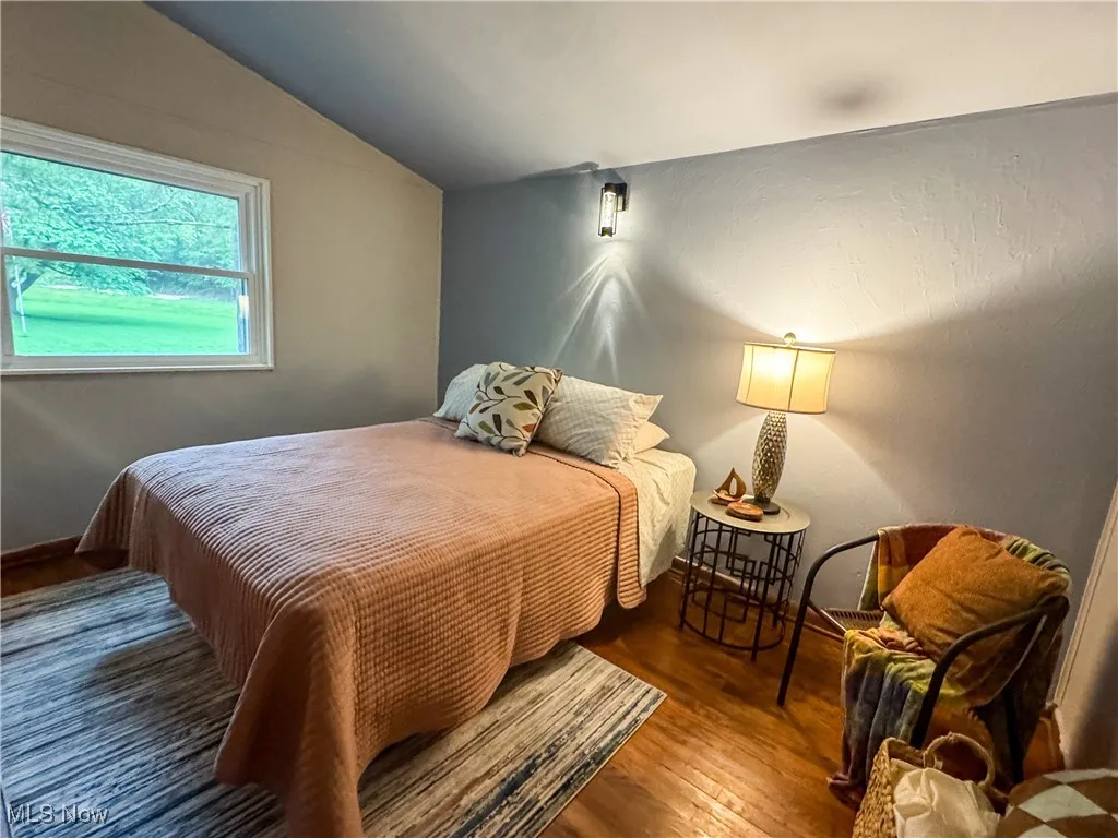 Bedroom 2 also has vaulted ceilings and original wood floors.