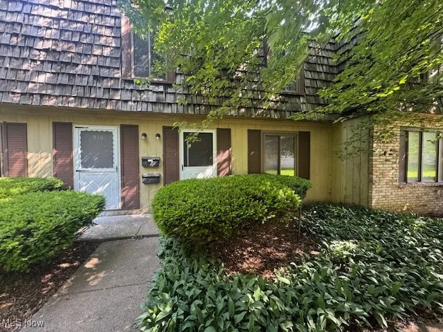 Doorway to property with brick siding