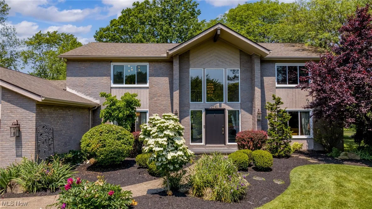 View of front of house with brick siding